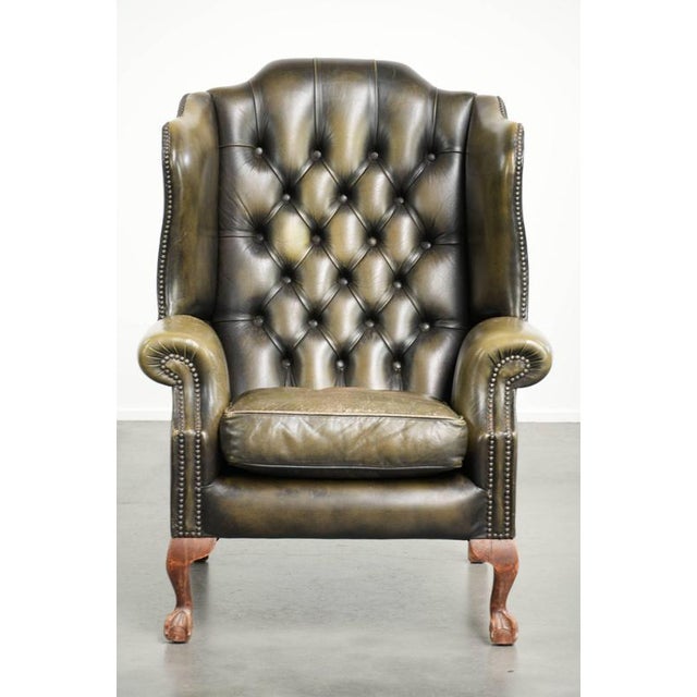 This rugged vintage cowhide Chesterfield wing armchair in a timeless green color. : This rugged vintage Chesterfield wing...