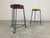 Mid-Century industrial stools with a red and yellow wooden seat and a black metal base. Very much in the style of Belgian...