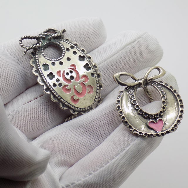 A delightful vintage pair of miniatures depicting baby bibs, handmade in Arezzo, Tuscany, Italy between the 1980s and...