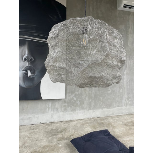 A bewitching minimalistic handcrafted knitted lamp for a stylish interior. The product is handmade from stainless wire in...