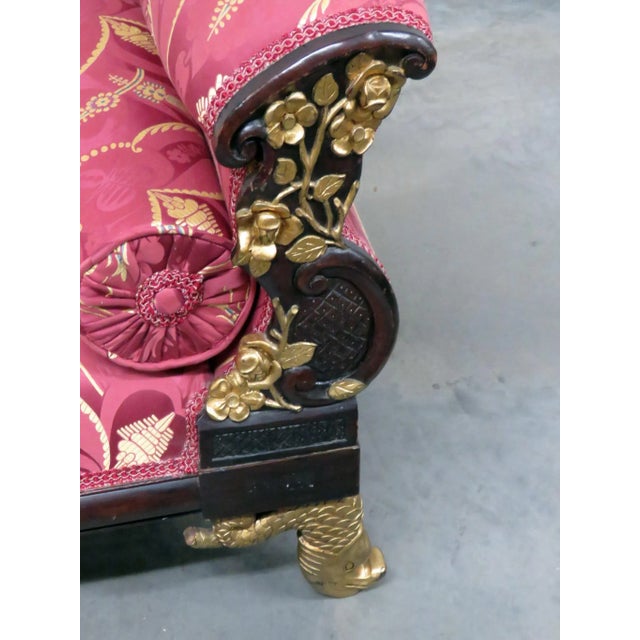 This striking French Empire style window bench, circa 1940, showcases exceptional craftsmanship and dramatic design...