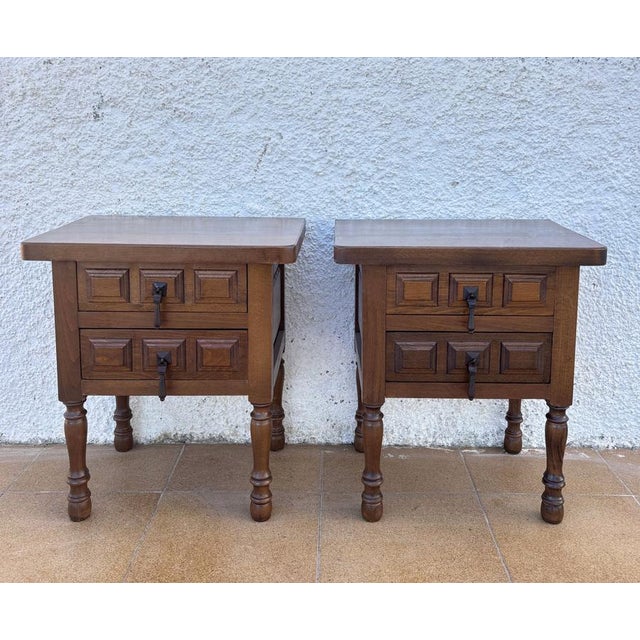 Charming pair of Spanish bedside tables crafted in solid wood, featuring a clean and balanced design inspired by...