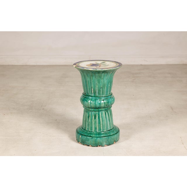 This antique Annamese ceramic pedestal showcases the vibrant glazes and sculptural forms associated with traditional...