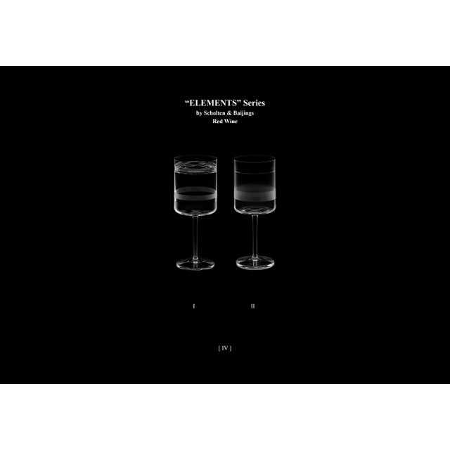 A pair of red wine glasses made by hand. Glass designed by scholten &amp; baijings as part of the elements&nbsp;series. a...