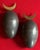 Pair Johan Meijerink (Dutch 1948 - 2011) bronze ovoid egg wall sculptures with crescent finials. The eggs with a gray...