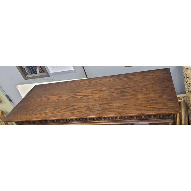 Super nice Jacobean tall oak china cabinet. Features one large cabinet over two small cabinet door, stretcher base, turnip...