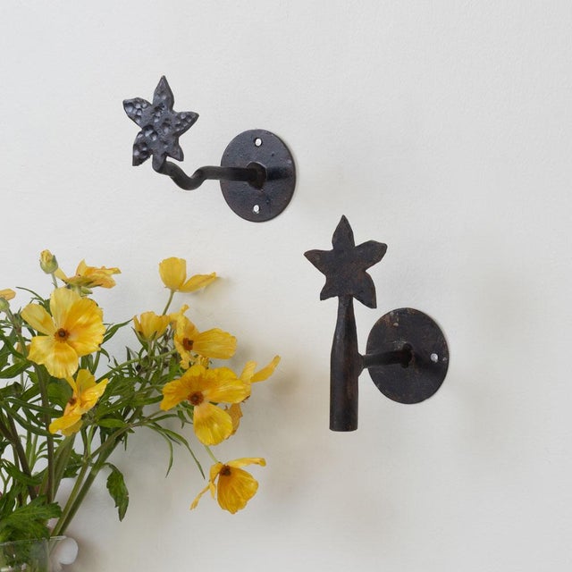 Unique wrought iron wall hook from Spain, 1950s. Black iron flower with stem and round iron backplate. Original iron...