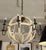Design Plus Gallery presents a Globe Chandelier from Port & Manor. The fixture has a distressed finish on both the white...