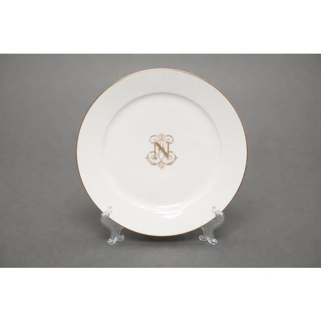 A refined set of six late 19th century Sevres porcelain plates decorated with the imperial “N” monogram in delicate...