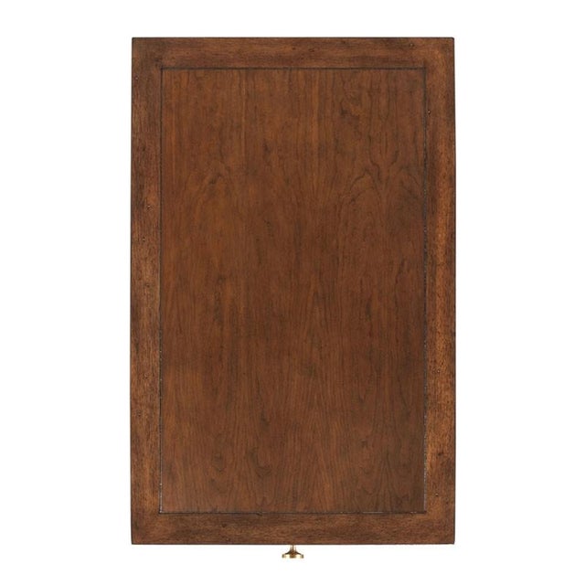 A handy table for drinks to have at your chairside with a rectangular framed top over an apron rail drawer elevated on...