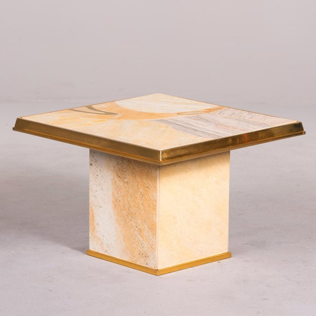 Found in England, this porcelain and brass side or accent table dates from the 1970s. The top is 24.25” square and...