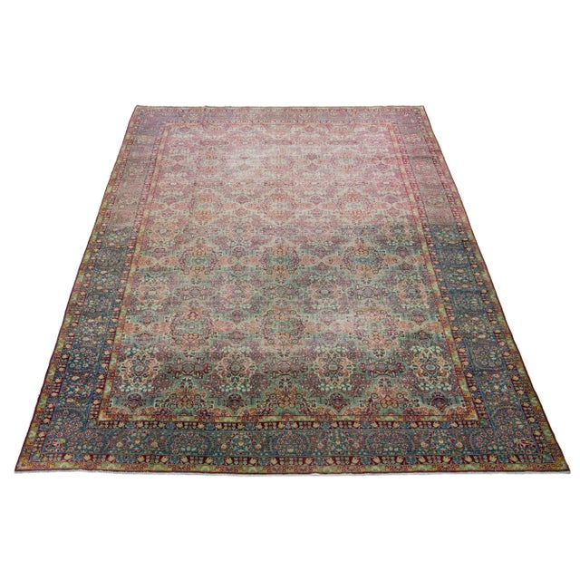 This Persian Tabriz wool rug is handcrafted and showcases a captivating traditional floral pattern. The mesmerizing...