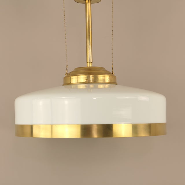 Massive brass chandelier with a pull system, freely adjustable, total length 100cm-140cm The lamp has an original...