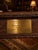 An exceptional English hand-carved solid oak refectory table, dating to 1936 and retaining its original brass presentation...