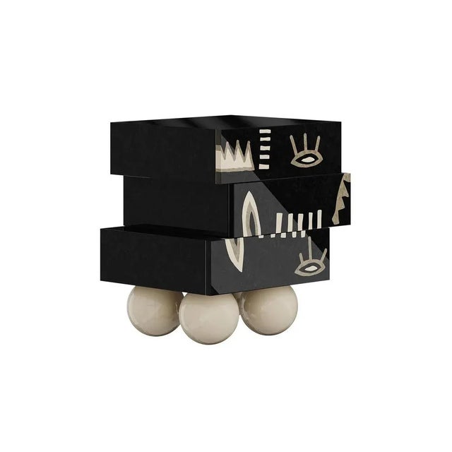 Tribal Bedside Table brings an unmistakable design style. This modern black bedside is a bold furniture piece that will...