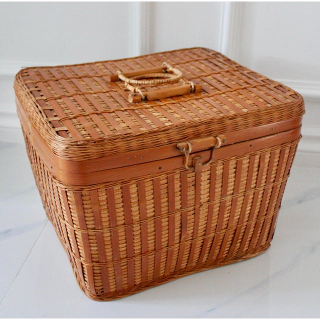A vintage large Asian wicker lidded picnic / storage basket with handles. Perfect storage basket that can fit in a...