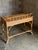 Great 1980s burnt bamboo desk with two drawers. Skelton frame in burnt bamboo with cane surface and wrapped rattan corners...