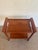 A handsome 1970s serving cart in the Danish Modern style, crafted with a solid teak frame and sculpted, integrated...