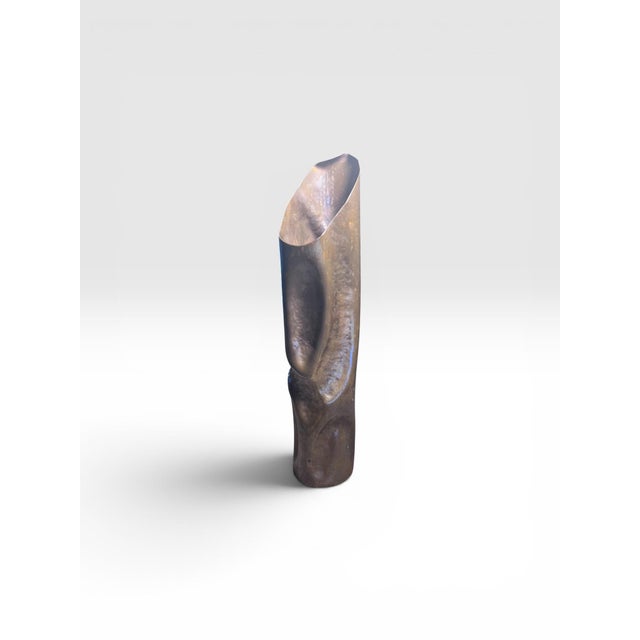 A striking Mid-Century Brutalist copper sculptural vase featuring an elegant organic silhouette and hand-worked surface....