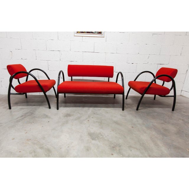 Living room set, sofa and two designer armchairs from 2001, red in color. They are clean, with their black tubular...