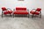 Living room set, sofa and two designer armchairs from 2001, red in color. They are clean, with their black tubular...