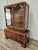 A splendid vintage display cabinet dating back to the 1940s, featuring a refined Art Deco style and rich walnut grain,...
