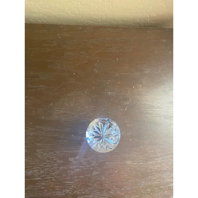 Lovely vintage cut glass decanter with stopper. Some chipping around the rim and slight chips on the bottom of the...