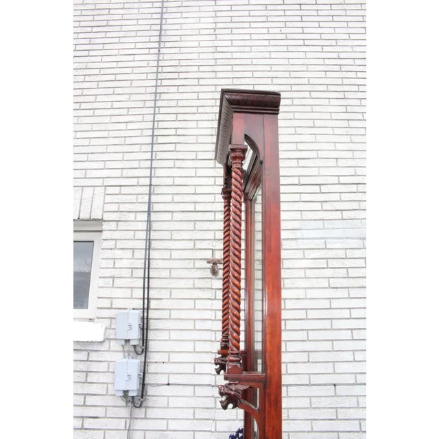 Spectacular antique tall American made Victorian mirror with a beautiful carved frame made of cherry. Exceptional piece...