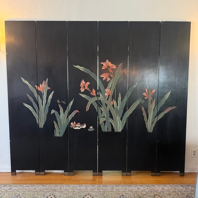 Monumental 1920s Chinese double-sided black lacquer six-panel folding screen. Features an elaborate architectural garden...
