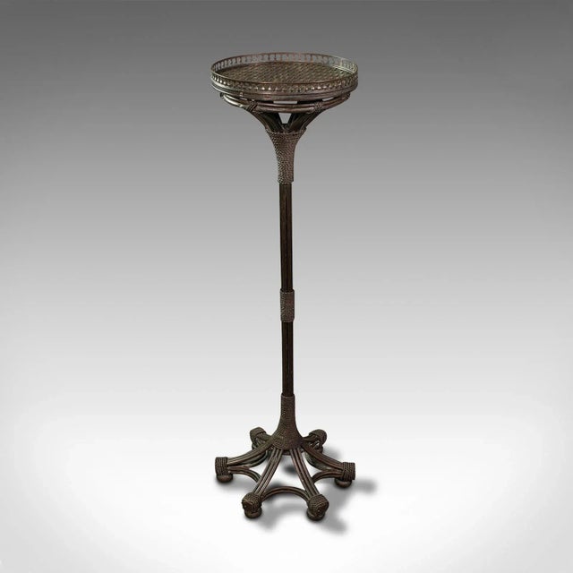 This is a vintage decorative torchere. An English, patinated brass planter or jardiniere, dating to the mid 20th century,...