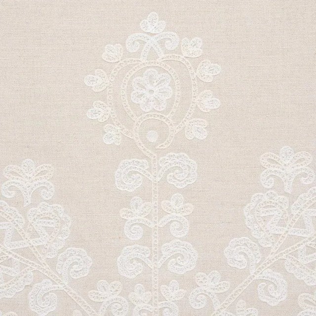 Estrella's stylized floral motifs are delicately embroidered on a Cotton-Linen ground. Its open design layers beautifully...