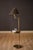 Mid Century Modern sculptural brass floor lamp with an attached round side table by Hart Associates, circa 1960's. This...