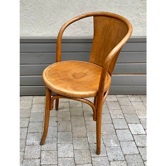 Rare early 20th-century bentwood armchair manufactured by fischel, circa 1905–1925. this unusual model features an elegant...