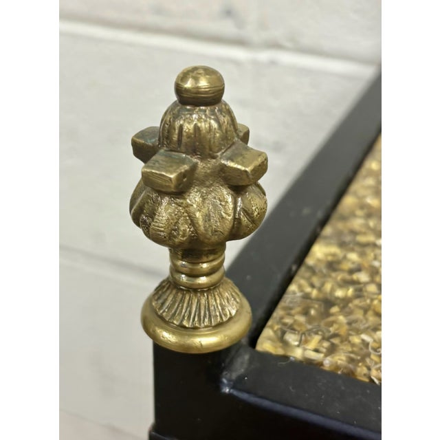 This is a gorgeous vintage and rare Hollywood Regency style iron and brass bar and wine rack with a top of gold-colored...