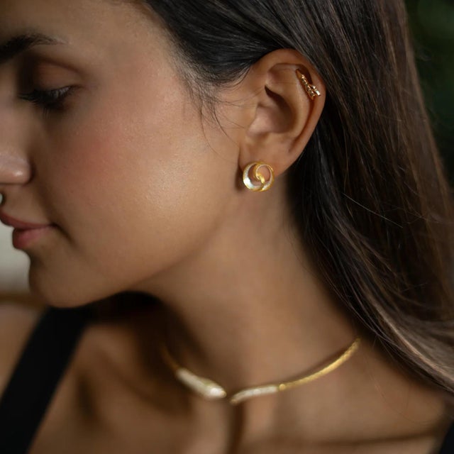 Elevate your everyday style with the Infinity Loop Mixed Metal Earrings. These unique stud earrings beautifully blend...