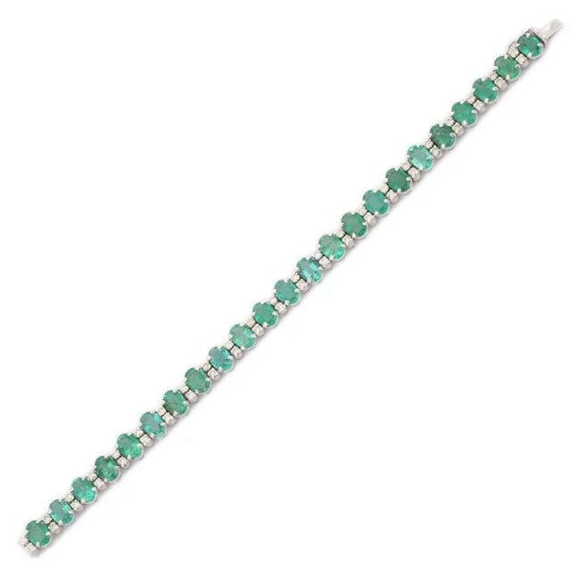 This is part of Chairish’s Fine Jewelry assortment. This Handcrafted Natural Emerald Diamond Tennis Bracelet in 14K gold...