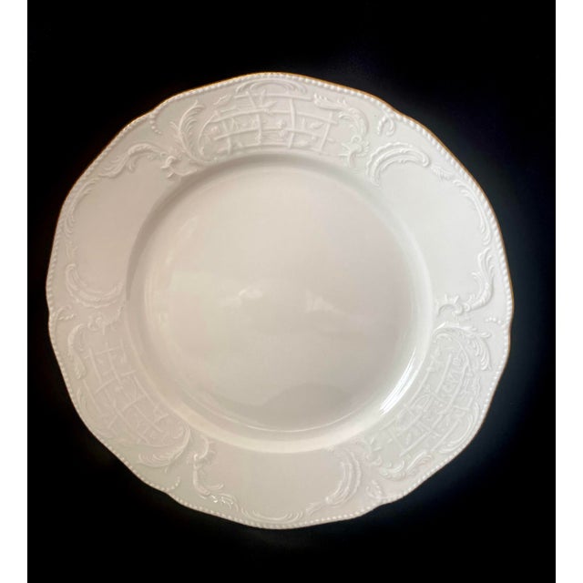 Pair of Rosenthal Sanssouci ivory porcelain 8 inch salad/desert plate, featuring an ornate embossed rim and a thin gold...