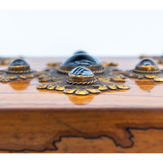 late Victorian Gothic Revival olivewood and banded agate jewellery box with brass mounts. Circa 1880. Veneered in highly...