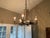 An impressive Naos Forge hand-forged iron chandelier, featuring elaborate scrolling ironwork, dimensional acanthus and...