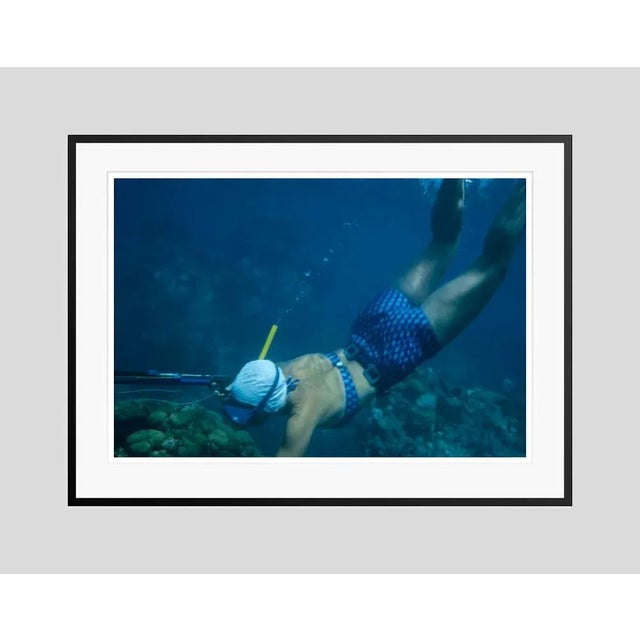 Speargun Fishing In Antigua 1961 by Toni Frissell A femail diver speargun fishing in Antigua, 1961 Antoinette Frissell...