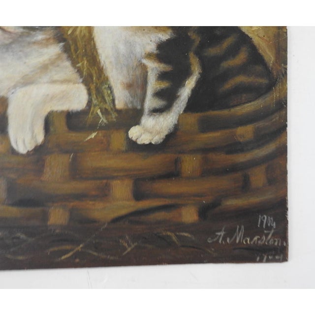 Antique 1904 oil on artist board folk art painting of three kittens in an old basket. Signed A. Marston and dated 1904...