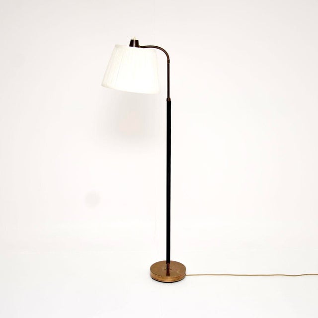 A superb vintage Swedish leather and brass floor lamp. This was recently imported from Sweden, it dates from the 1950’s....