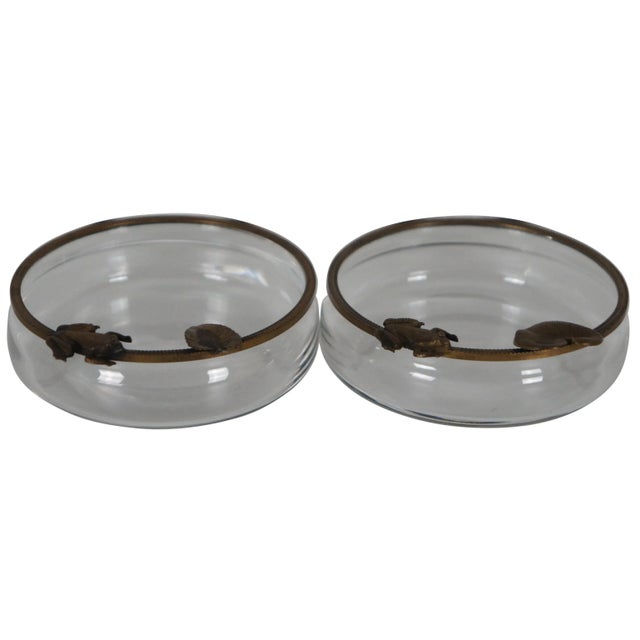 Pair of vintage glass candy or nut dishes with brass edges decorated with frogs and lily pads.