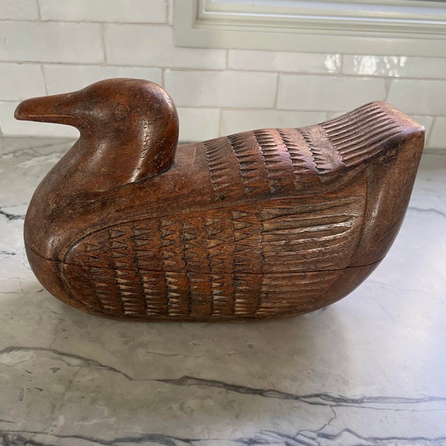 Vintage hand carved teak wood duck box from Thailand. Measures approximately 10'' X 6.5". The duck has a secret...