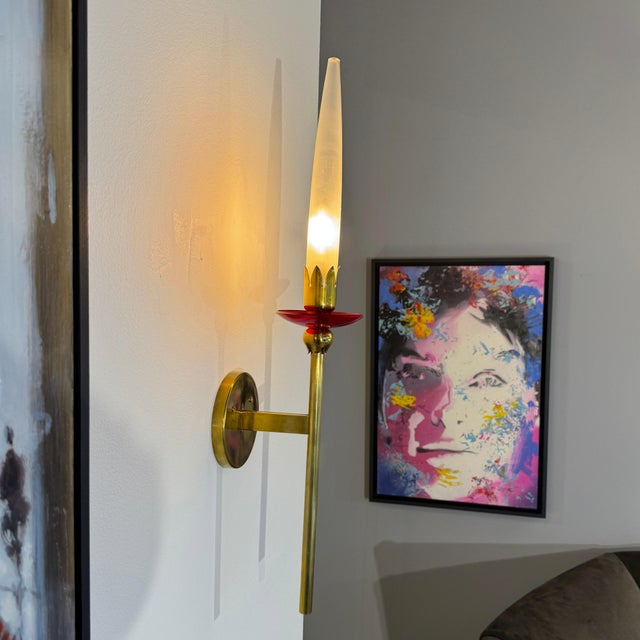 Pair of sconces by Angello Lelli for Arredoluce. Brass base, frosted glass shades and red acrylic bobeche detail. 2...