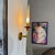 Pair of sconces by Angello Lelli for Arredoluce. Brass base, frosted glass shades and red acrylic bobeche detail. 2...