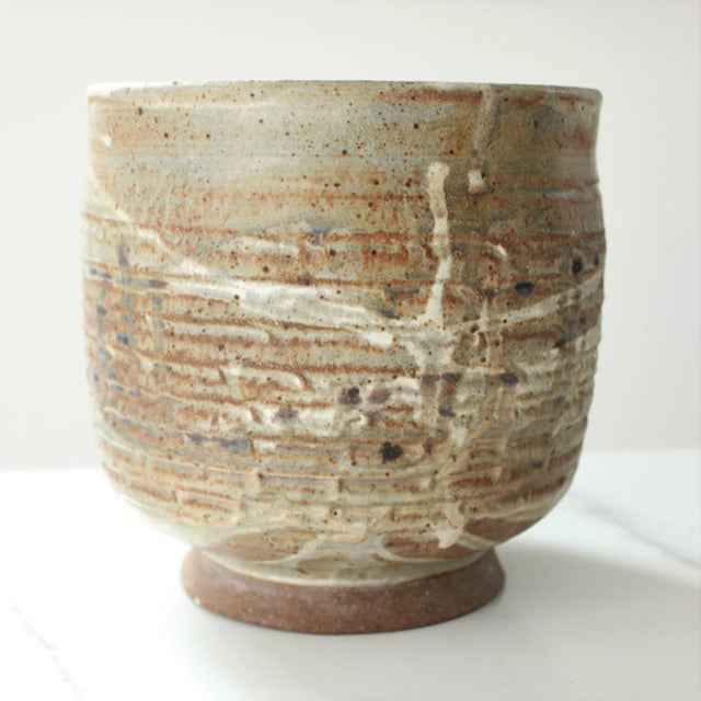 1986 signed art studio pottery utensil holder/planter! We love that it's a one-of-a-kind and hand crafted of clay. Neutral...