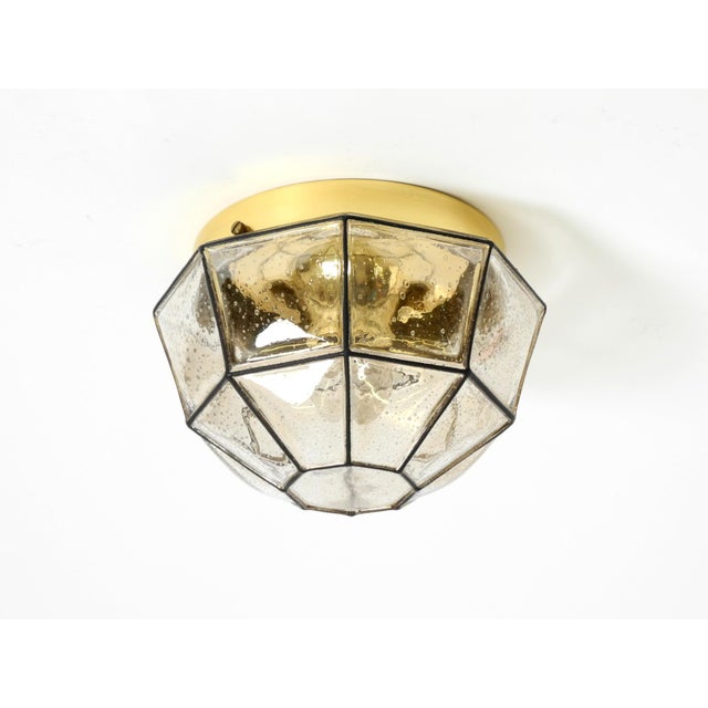 Beautiful original 1970s glass ceiling lamp in an octagonal shape. the shade has a light gold tint and small air bubbles....