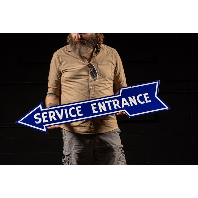 Vintage double-sided porcelain directional sign featuring bold white "Service Entrance" lettering against a royal blue...