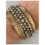 Absolutely breath taking 14k bi-colored gold bangle. With a floral motif, in-set with three rows of cultured pearls and...